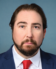 Official portrait of Rep. Elijah Crane